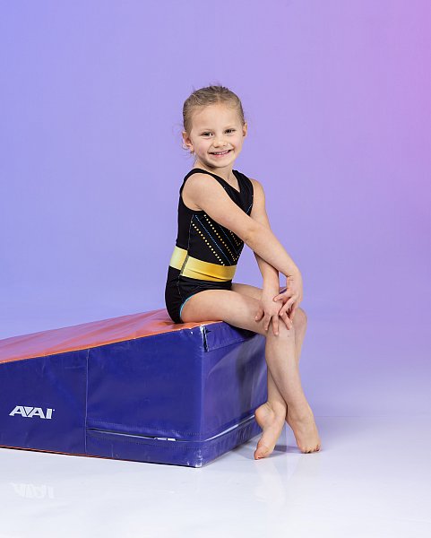 little girl gymnastics sport portrait purple background