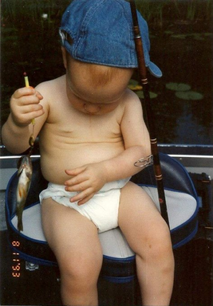 Childhood photo of Chase fishing in diaper