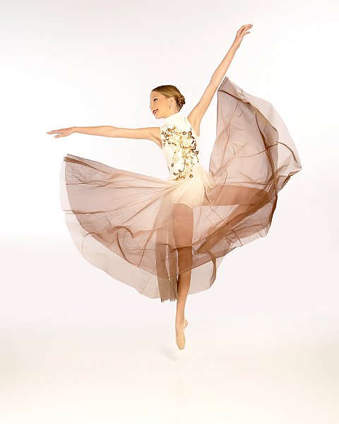 ballerina jumping and fanning out skirt